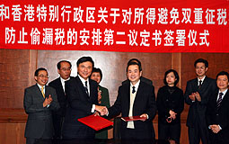 KC Chan, Wang Li signs taxation deal