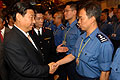 Vice-President Xi shakes hand with a HK rescue team member