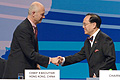 Pascal Lamy, Donald Tsang shake hands