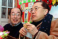 Donald Tsang tries red bean cake